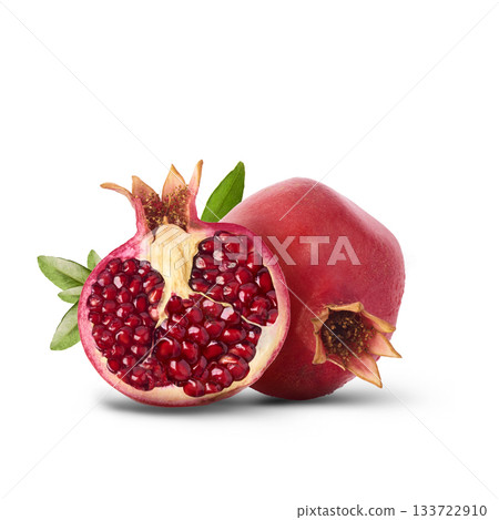 Flying in air fresh ripe whole and cut pomegranate with seeds and leaves isolated. High resolution image Flying in air fresh ripe whole and cut pomegranate with seeds and leaves isolated. High resolution image 133722910