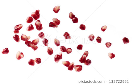 Flying in air fresh ripe whole and cut pomegranate with seeds and leaves isolated. High resolution image 133722931