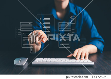 Businesswoman is signing electronic documents on virtual screen, using digital technology to manage online contracts and streamline document management in modern business operations. 133723049