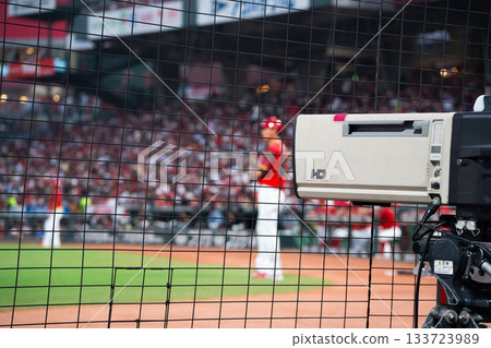 A large television camera broadcasting live from Mazda Stadium Hiroshima 133723989