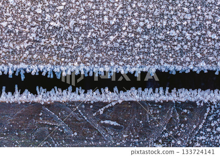 Frost Ice Crystals Formed on the wood in Nature. Abstract nature Frost Ice Crystals Formed on the wood in Nature. Abstract nature 133724141