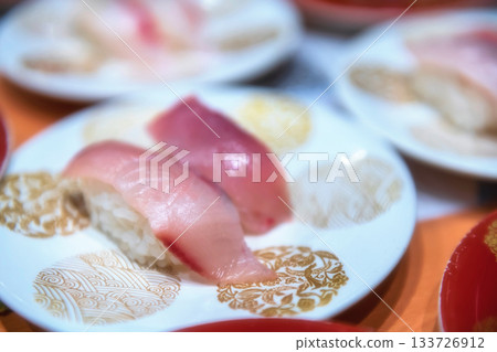 hamachi sushi on white painted porcelain plate in Japanese restaurant hamachi sushi on white painted porcelain plate in Japanese restaurant 133726912