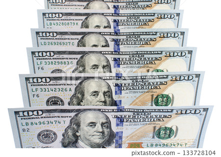 Banknotes of one hundred dollars in a row close up Banknotes of one hundred dollars in a row close up 133728104
