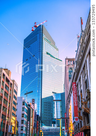 Tokyo cityscape in Japan: View of the redevelopment project in Nihonbashi 1-chome and Mitsukoshi department store. Towards a new era 133729495