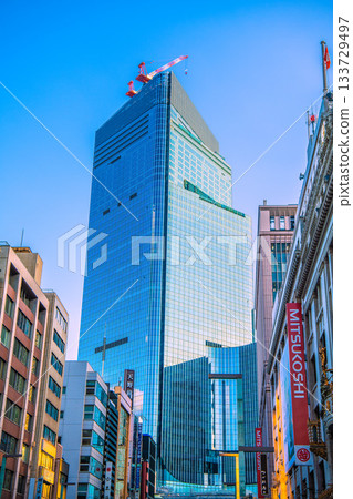 Tokyo cityscape in Japan: View of the redevelopment project in Nihonbashi 1-chome and Mitsukoshi department store. Towards a new era 133729497