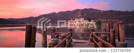 Fantastic pink sunrise on lake Orta Italy Fantastic pink sunrise on lake Orta Italy 133730789