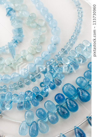 Natural aquamarine beads — a beautiful, clear blue jewelry material Natural aquamarine beads — a beautiful, clear blue jewelry material 133730960