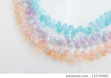 Pastel-colored natural stone beads — jewelry material with soft colors that shine like opals Pastel-colored natural stone beads — jewelry material with soft colors that shine like opals 133730993
