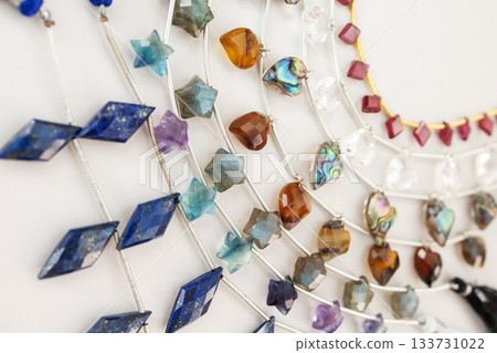 A diverse collection of natural stone beads — star, heart, and diamond shaped jewelry materials A diverse collection of natural stone beads — star, heart, and diamond shaped jewelry materials 133731022