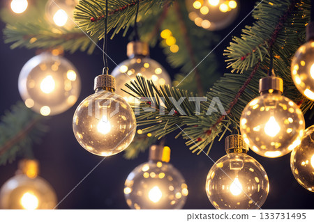 Christmas decorations covered by snow and Christmas tree branches with toys and lights are a beautiful background for the New Year holiday Christmas decorations covered by snow and Christmas tree branches with toys and lights are a beautiful background for the New Year holiday 133731495
