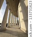 The marble corridor of the temple bathed in the setting sun 133731623