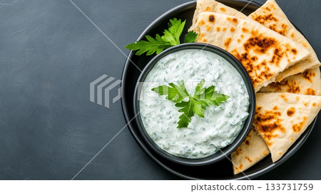A Refreshing Yogurt Dip that pairs perfectly with Crispy Pita Bread Snacks and is delightful to enjoy 133731759