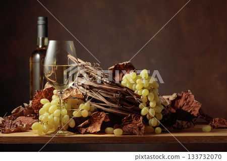 White wine and bunch of grapes. 133732070