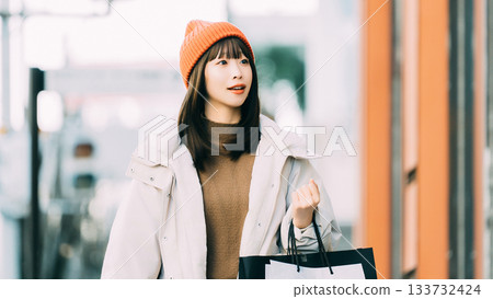 Woman shopping in the winter city 133732424