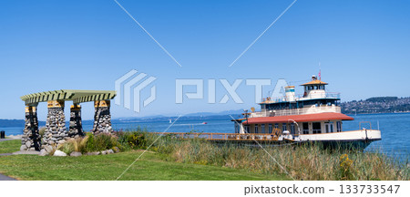 Touristic boat at sea marina. Ship boat in marina. Travel destination. Boat trip. Sea vacation on summer. Boating charter. Boat or ship for touristic route. Touristic tour destination 133733547