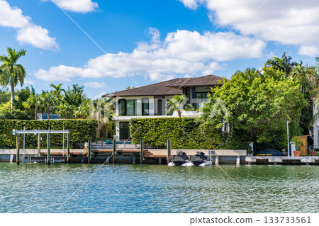 City waterfront with private house. Vacation building in summer. Luxury waterfront house. Hotel building architecture. Residential house. Modern building. Residential apartment in waterfront city 133733561