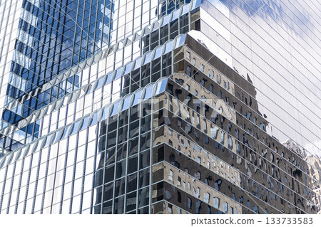 Glass building window. Architectural detail. Background of architecture. Modern glass background. Glass facade background. Architecture. Building facade geometric architecture. Building background Glass building window. Architectural detail. Background of architecture. Modern glass background. Glass facade background. Architecture. Building facade geometric architecture. Building background 133733583