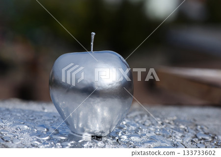 Silver metallic apple chrome sculpture grey monochrome color is modern art from steel or aluminum, copy space advertisement Silver metallic apple chrome sculpture grey monochrome color is modern art from steel or aluminum, copy space advertisement 133733602