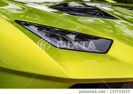 Chicago, Illinois - September 29, 2024: 2021 Lamborghini Huracan STO. Metallic green 2021 Lamborghini Huracan STO parked on the street. Lamborghini is italian Luxury car. 133733635