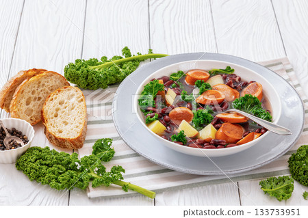 Red kidney bean, potato, kale and sausage soup 133733951