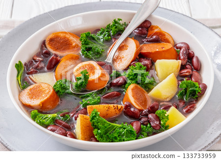 Red kidney bean, potato, kale and sausage soup 133733959