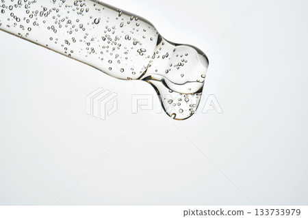 Cosmetic pipette dropping serum with air bubbles Cosmetic pipette dropping serum with air bubbles 133733979