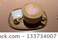 Heart shaped pink latte with gold sprinkles  133734007