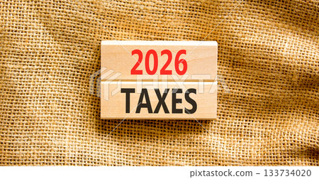 2026 taxes new year symbol. Concept words 2026 taxes on beautiful wooden blocks. Beautiful canvas background. Business and 2026 taxes new year concept. Copy space. 133734020