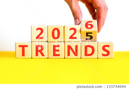 2026 Trends new year symbol. Concept words 2026 Trends on beautiful wooden blocks. Beautiful white and yellow paper background. Businessman's hand. Business 2026 Trends new year concept. Copy space. 2026 Trends new year symbol. Concept words 2026 Trends on beautiful wooden blocks. Beautiful white and yellow paper background. Businessman's hand. Business 2026 Trends new year concept. Copy space. 133734044