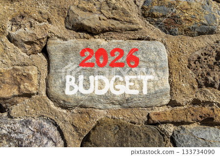 2026 Budget symbol. Concept words 2026 Budget on beautiful grey stone on stone wall. Beautiful stone wall background. Business and 2026 budget concept. Copy space. 2026 Budget symbol. Concept words 2026 Budget on beautiful grey stone on stone wall. Beautiful stone wall background. Business and 2026 budget concept. Copy space. 133734090