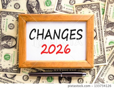 Changes 2026 symbol. Concept words Changes 2026 on beautiful wooden picture frame. Beautiful dollar bills background. Black pen. Dollar bills. Business and changes 2026 concept. Copy space. Changes 2026 symbol. Concept words Changes 2026 on beautiful wooden picture frame. Beautiful dollar bills background. Black pen. Dollar bills. Business and changes 2026 concept. Copy space. 133734126