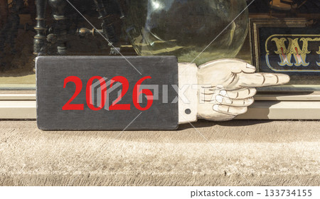 Business concept of 2026 new year symbol. Concept number 2026 Happy new year on beautiful wooden hand sign. Beautiful display shop background. Business 2026 happy new year concept. Copy space. 133734155