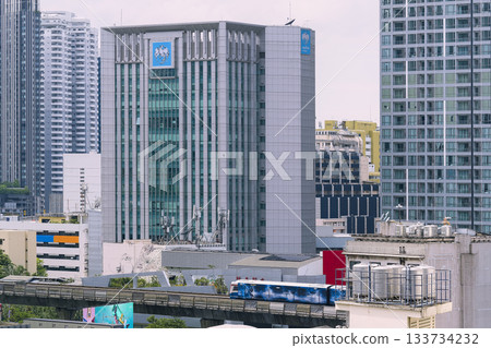 Buildings and Skytrain in central Bangkok, Thailand 133734232