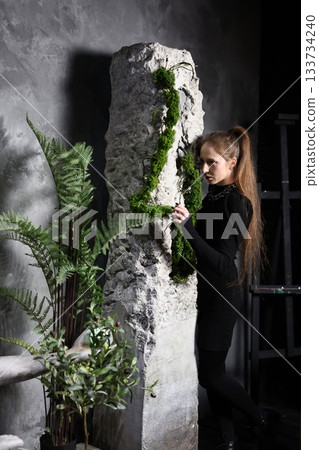 Peaceful female instructor engaging in mindful practice outside Peaceful female instructor engaging in mindful practice outside 133734240