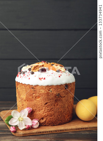 Traditional easter cakes with colorful sprinkles, with eggs, a bunny figurine, and spring flowers, creating a festive holiday scene Traditional easter cakes with colorful sprinkles, with eggs, a bunny figurine, and spring flowers, creating a festive holiday scene 133734941