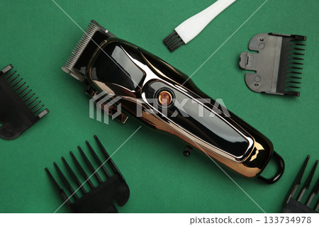 Hair clipper on green background. Modern hair clipper. 133734978