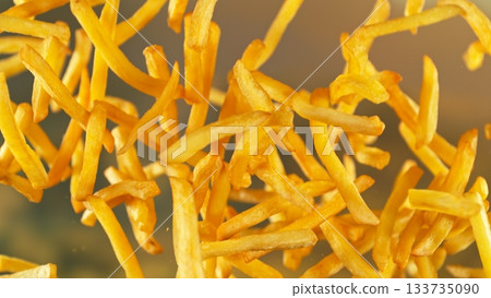 French Fries , Fried Potatoes Flying up in the Air . Concept of Junk Food 133735090