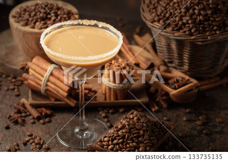 Chocolate martini cocktail or Irish cream liquor on a brown background. Chocolate martini cocktail or Irish cream liquor on a brown background. 133735135
