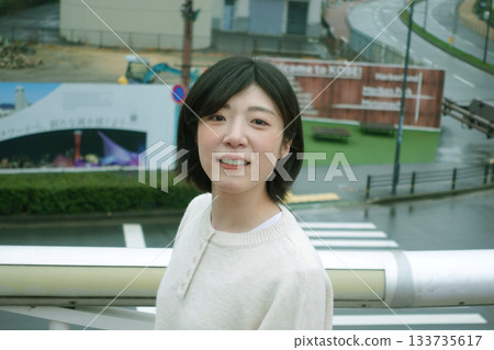 Woman looking out at the city 133735617