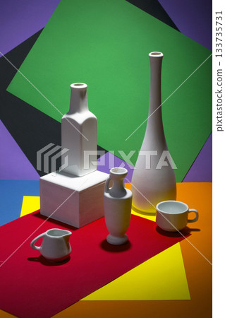 Still life with white vases on a color abstract background. 133735731
