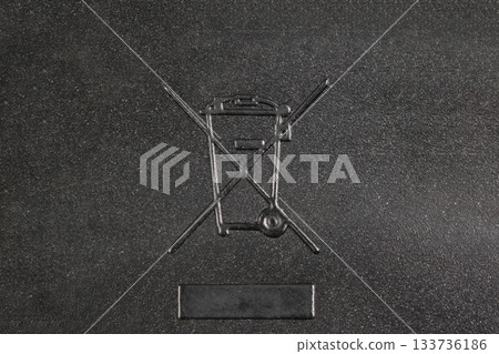 WEEE Symbol Crossed-Out Wheeled Bin on Dark Background WEEE Symbol Crossed-Out Wheeled Bin on Dark Background 133736186