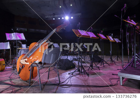 The orchestra's musical instruments are laid out on their workbenches, prepared before the concert. The orchestra's musical instruments are laid out on their workbenches, prepared before the concert. 133736276