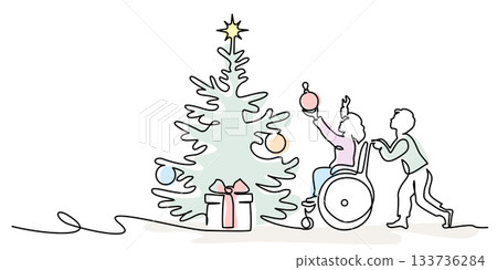 Child in wheelchair decorates a Christmas tree together with friend. 133736284