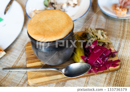 Gather around a beautifully set table to enjoy a luxurious family dinner. 133736379