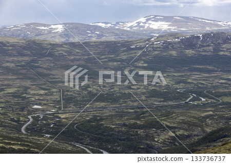 Road E6 winding through DovrefjellSunndalsfjella National Park offers stunning natural scenery 133736737
