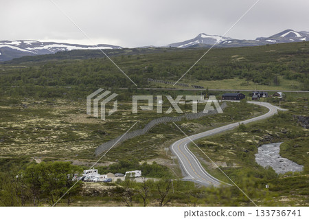 Road E6 winds through DovrefjellSunndalsfjella National Park showcasing Norway's stunning nature and remote camping areas 133736741