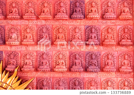 A bas-relief with multiple Buddha figures in Nanshan Park, Sanya, Hainan. A bas-relief with multiple Buddha figures in Nanshan Park, Sanya, Hainan. 133736889