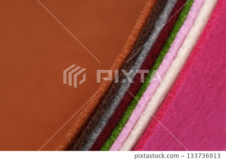 Colorful multicolored felt. The thickness is clearly visible. Samples of soft fabric. Wave. Close-up. For design projects, textile layouts, sewing and handicraft materials, or as a colorful background 133736913