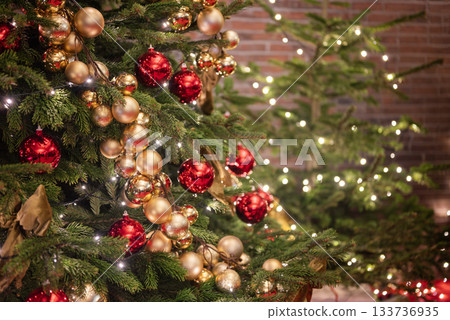Banner of a decorated Christmas and New Year's tree with decorations and bokeh  133736935