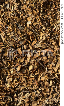 Close-Up Of Brown Wood Chips And Mulch For Landscaping And Garden Groundcover Close-Up Of Brown Wood Chips And Mulch For Landscaping And Garden Groundcover 133736971